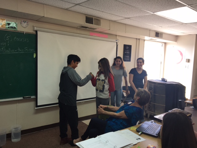 Teen peers leading the “Green Ribbon” activity at a “Talking Mental Health” presentation at South Valley Academy in Albuquerque